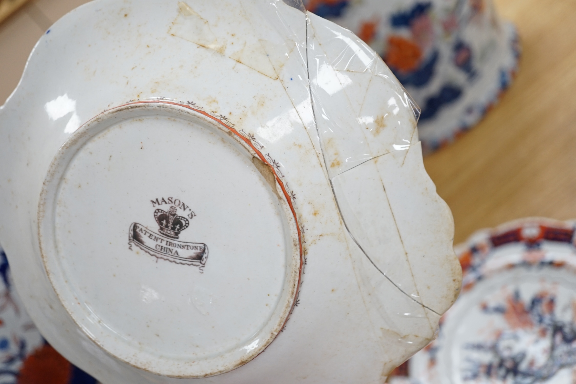 Seventeen ironstone items including two jardinières, a tureen and a quantity of plates, largest 28cm high. Condition - poor to fair